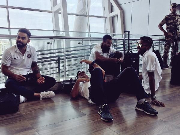 MS Dhoni relaxes on the floor of Chennai airport. MS Dhoni