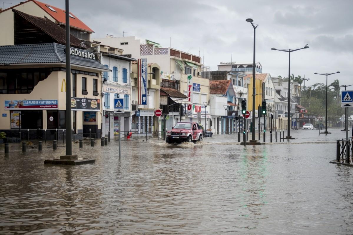 A motorist drives on the flooded waterfront in Fort-de-France, on the French Caribbean island of Martinique, after it was hit by Hurricane Maria Hurricane Maria