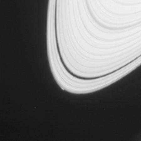 The disturbance visible at the outer edge of Saturn's A ring in this image from NASA's Cassini spacecraft could be caused by an object replaying the birth process of icy moons. nasa, Saturn, Cassini, space,