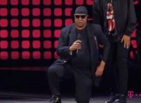 Stevie Wonder takes a knee for America
