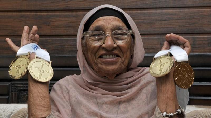 Mann Kaur holding her medals Mann Kaur