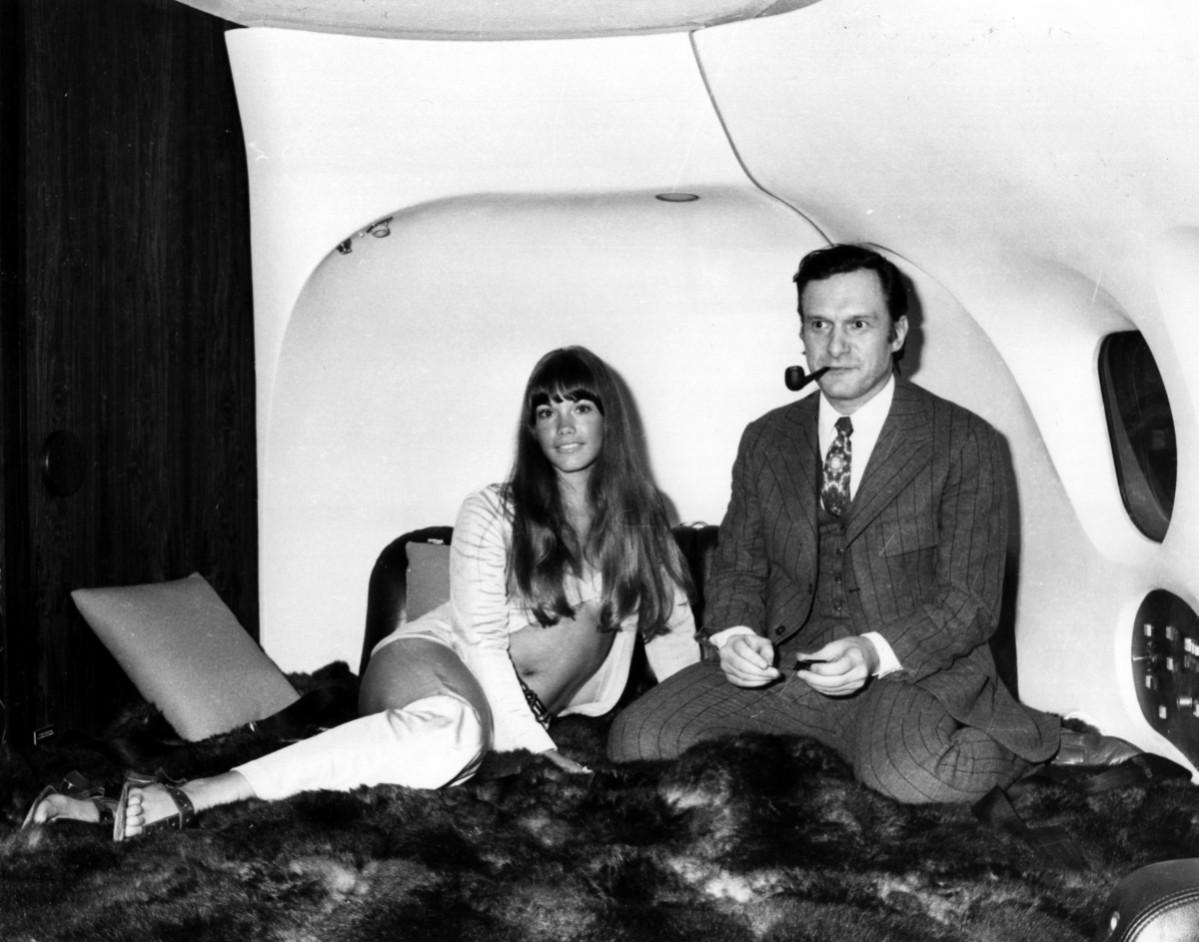 The president of Playboy Enterperises, Hugh Hefner with girlfriend, Barbi Benton in his luxury DC-9 aircraft 'The Big Bunny' at Heathrow. Hugh Hefner