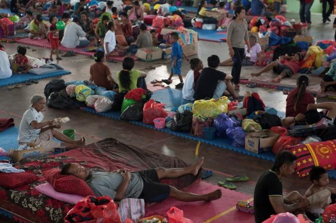 Villagers rest at a temporary evacuation center for people living near Mount Agung, a volcano on the highest alert level, inside a sports arena in Klungkung, on the resort island of Bali. Mount Agung
