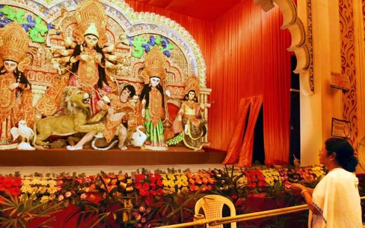 In picture: West Bengal Chief Minister and Trinamool Congress chief Mamata Banerjeepays tribute to Goddess Durga on September 25, 2017. Mamata Banerjee