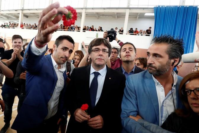 In picture: Catalan President Carles Puigdemont (centre) visits the polling station he was announced to vote at in the banned independence referendum in Sant Julia de Ramis, Spain October 1, 2017. Catalan independence referendum