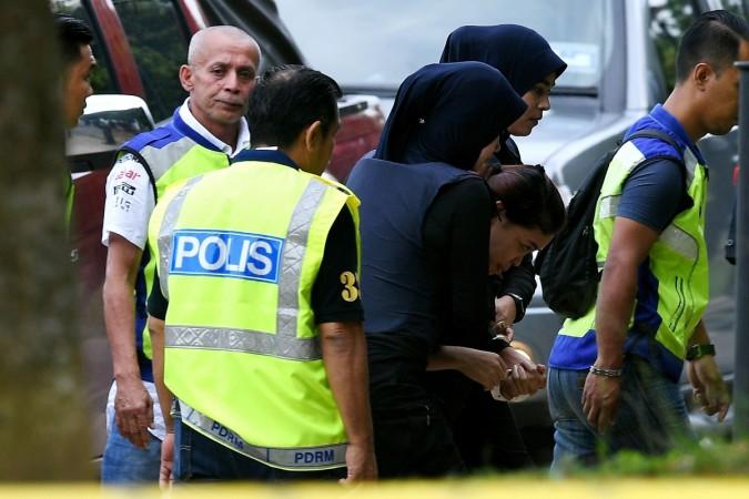 Indonesian national Siti Aisyah is escorted by Malaysian police for a court appearance Siti Aisyah