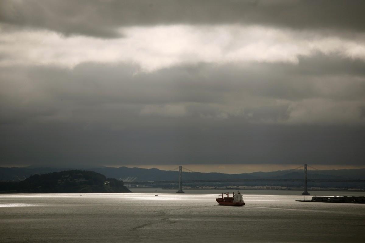 A container ship streams toward the Port of Oakland in this view from a vista point in Sausalito, California April 23, 2012. Oakland