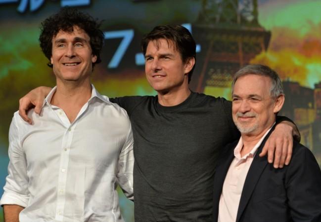 Edge of Tomorrow's Tom Cruise (C), accompanied by film director Doug Liman (L) and producer Erwin Stoff (R) Edge of Tomorrow