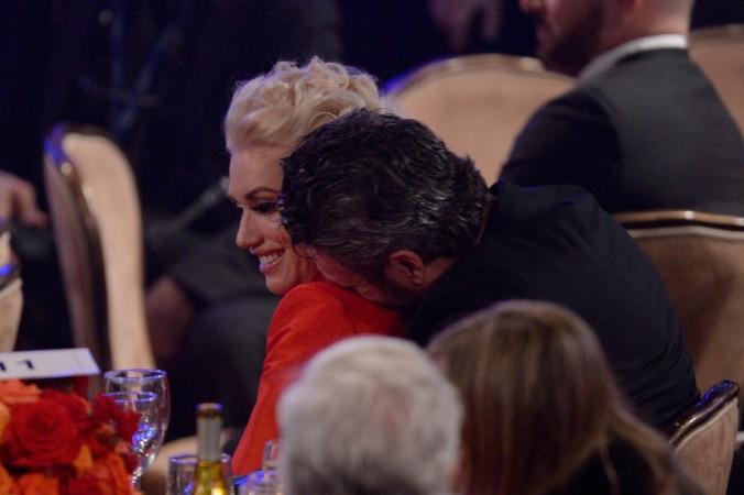 The couple sharing an adorable moment at the 2016 Pre-GRAMMY Gala. gwen and blake