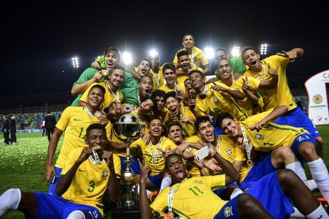 Brazil´s players celebrate with the trophy their first place finish in the South American U-17 football tournament in Rancagua, some 90 km south of Santiago de Chile on March 19, 2017 brazil football