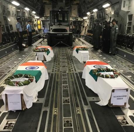 The military personnel being given honours. arunachal pradesh helicopter crash