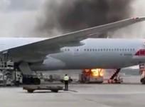 Fire breaks out next to American Airlines jet at Hong Kong airport
