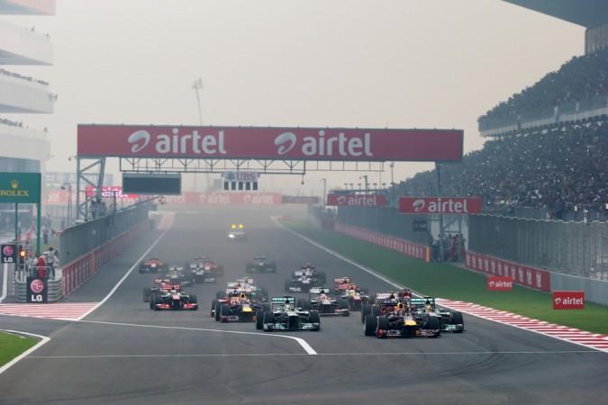 Sebastian Vettel of Germany and Infiniti Red Bull Racing leads the field into the first corner at the start of the Indian Formula One Grand Prix at Buddh International Circuit on October 27, 2013 in Noida, India. Buddh International Circuit, Indian grand prix