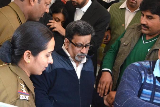 Rajesh Talwar at a special CBI court where Special Judge S Lal held them guilty in the sensational Aarushi-Hemraj double murder case in Ghaziabad on Nov.25, 2013 Rajesh Talwar