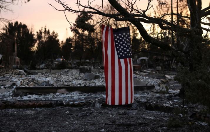 In picture: An American flag hangs from a tree in a neighbourhood destroyed by wildfire in Santa Rosa, California, US, October 12, 2017. California wildfires