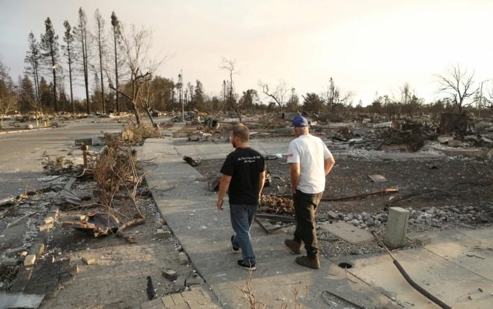 In picture: Area residents walk through a neighbourhood destroyed by wildfire in Santa Rosa, California, US, October 12, 2017. California wildfires