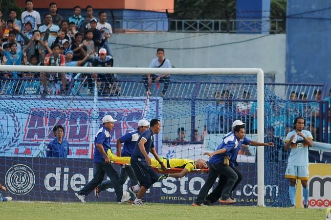 Goalkeeper Choirul Huda of hometown club Persela in East Java being rushed away on a stretcher and taken to hospital after colliding with Brazilian midfielder Ramon Rodrigues during a match at Surajaya Lamongan stadium in Surabaya. Indonesian football was in mourning after celebrated goalkeeper Choirul Huda died following an on-pitch collision with a team-mate. Huda, 38, a long-time regular for his hometown club Persela in East Java, collapsed just before half-time after Sunday's accidental clash with Brazilian midfielder Ramon Rodrigues choirul huda