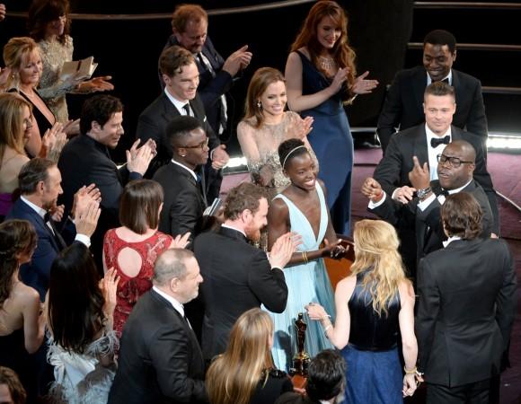 Lupita Nyong'o and the cast and crew of 12 Years A Slave amid celebrations at the Oscars, 2014. 12 years a slave