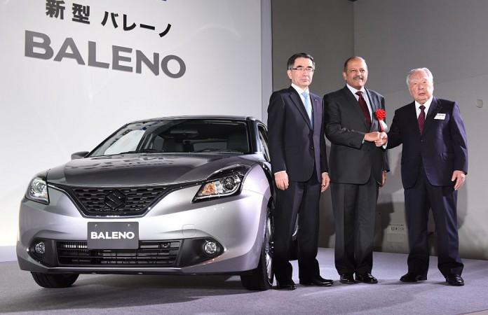 Osamu Suzuki (R), chairman of Japanese automaker Suzuki, poses with Indian ambassador to Japan Sujan R. Chinoy (C) and Suzuki company president Toshihiro Suzuki (L) during a press conference in Tokyo to introduce the company's new compact car Baleno, made in India, on March 9, 2016. maruti suzuki, suzuki motor corporation