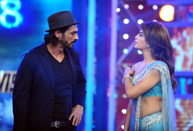 Indian Bollywood actors Arjun Rampal (L) and Jacqueline Fernandez on the set of television show Bigg Boss 8 in Lonavala on January 3, 2015. Jacqueline Fernandez Arjun Rampal