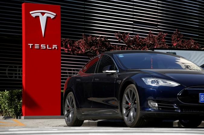 A Tesla car charges at a charging station in Beijing, China, April 18, 2017. Tesla Motors, Tesla China