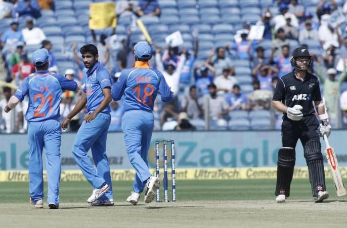 Bumrah (centre) celebrates dismissing Williamson (right) during the second ODI in Pune. Jasprit Bumrah