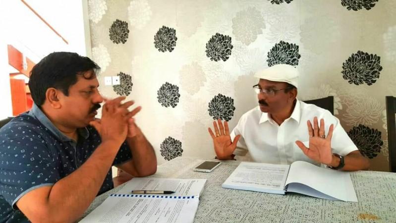 Sohan Roy and IV Sasi discussing the project Burning Wells. Burning wells, Sohan Roy, IV Sasi