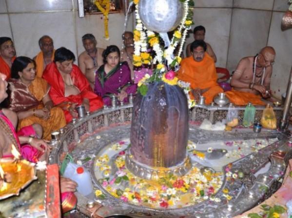 In the picture, temple priests conducting a ritual in Mahakaleshwar Temple in Ujjain Mahakaleshwar Shivaling