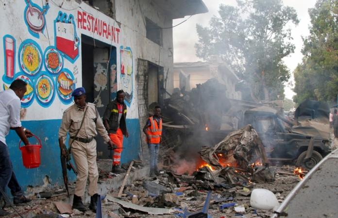 In picture: Somali security officers secure the scene of a suicide car bomb explosion, at the gate of Naso Hablod Two Hotel in Hamarweyne district of Mogadishu, Somalia October 28, 2017. Somalia blast