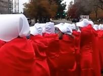Mike Pence greeted by Handsmaids in Denver