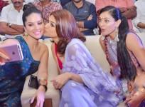 Shraddha Das kissing Sunny Leone at PSV Garuda Vega event