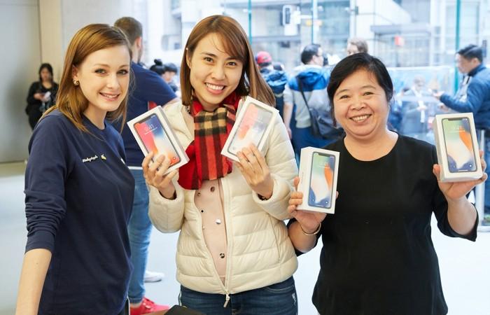 Customers with the new iPhone X in Sydney. Customers with the new iPhone X in Sydney