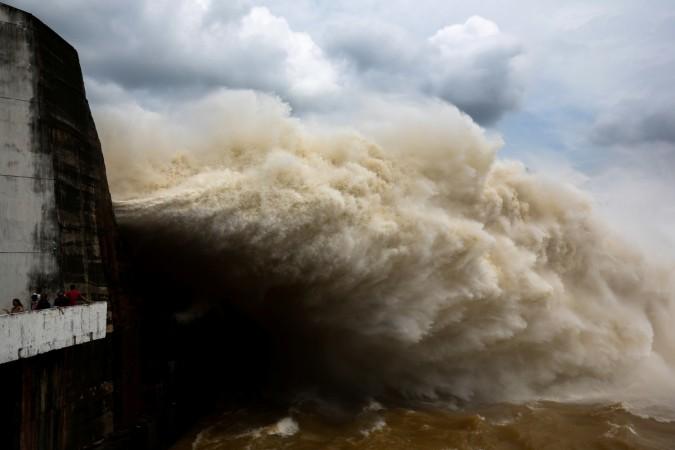 People watch as Hoa Binh hydroelectric power plant opens the flood gates after a heavy rainfall caused by typhoon in Vietnam Vietnam typhoon