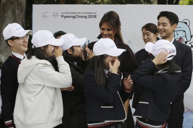 Melania Trump is greeted by South Korean middle school students as Choi Min-ho, a member of South Korean boy band Shinee, watches, during the 'Girls Play 2!' Initiative. Melania Trump Choi Min-ho