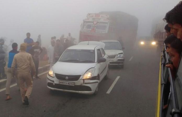 A view of the damaged vehicles after moving vehicles rammed into each other as smog cover reduced visibility on the Yamuna Expressway in Mathura on Nov 8, 2017 Yamuna expressway