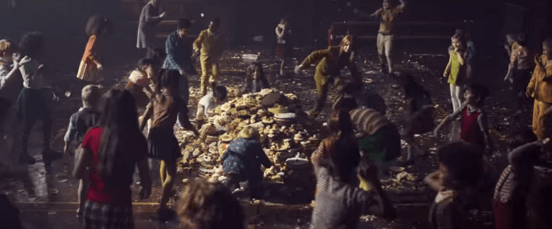 The kids hurl and throw and smear as they all get heavily involved in the food fight. fight