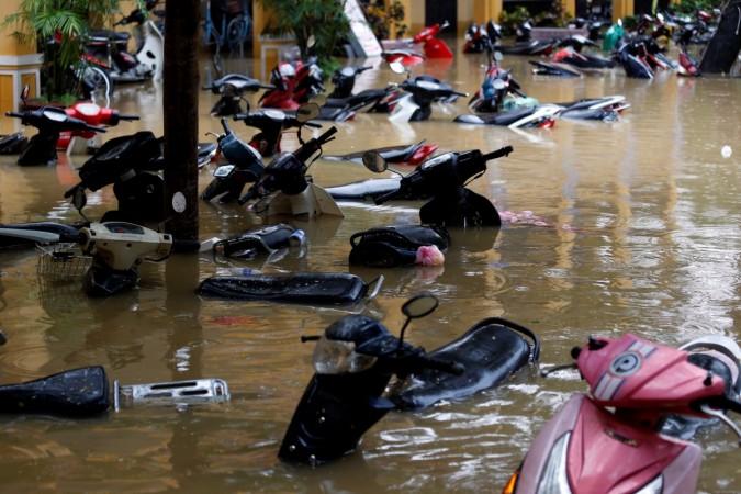 Motorbikes are seen along a flooded street at the UNESCO heritage ancient town of Hoi An after typhoon Damrey Vietnam