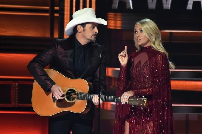 Co-hosts Brad Paisley and Carrie Underwood speak onstage at the 51st annual CMA Awards at the Bridgestone Arena on November 8, 2017 in Nashville, Tennessee. cma
