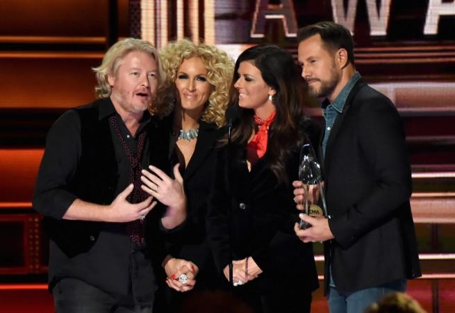 Philip Sweet, Kimberly Schlapman, Karen Fairchild, and Jimi Westbrook of Little Big Town accept an award onstage at the 51st annual CMA Awards at the Bridgestone Arena on November 8, 2017, in Nashville, Tennessee. cma 2