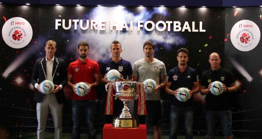 (L to R) John Johnson of Bengaluru FC, Bruno Filipe Tavares Pinheiro of FC Goa, Lucian Goian of Mumbai City FC, Henrique Sereno of Chennaiyin FC, Marcelo Leite Pereira of FC Pune City and Iain Hume of Kerala Blasters FC pose for picture with the ISL 2017 Trophy indian super league, isl