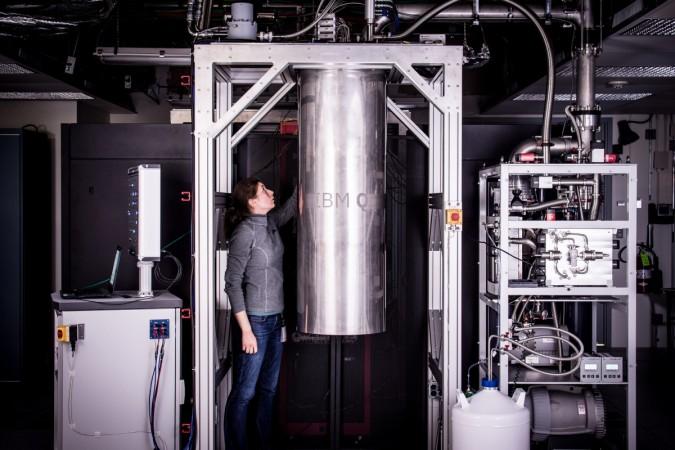 IBM Research Staff Member Katie Pooley is examining a cryostat with the new prototype of a commercial quantum processor inside. IBM quantum computer