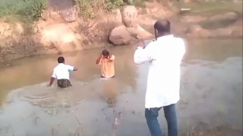 BJP leader Bharat Reddy is seen filming a video standing near the pond that two Dalits were apparently forced into. Reddy111