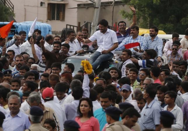 Patidar leader Hardik Patel waves upon arrival at his hometown after being released from jail, in Viramgam, near Ahmadabad, on July 16, 2016. Patel leader-PAAS
