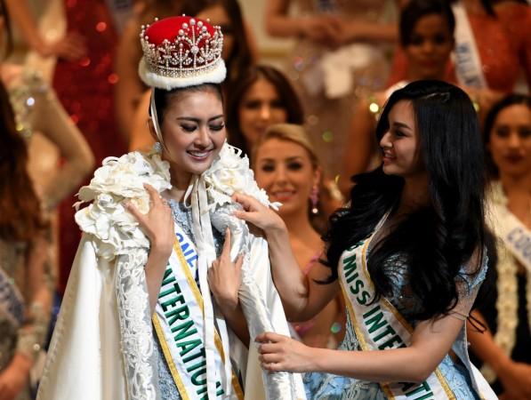 Miss Indonesia Kevin Lilliana (L) receives the 2017 Miss International crown and gown from 2016 Miss Internatinal Kylie Verzosa from Philippines during the Miss International Beauty Pageant final in Tokyo Miss international 2017 winner, Indonesia