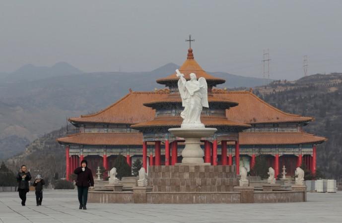 Villagers walk at a square to pray, on the top of a hill, near a Catholic church on the outskirts of Taiyuan, North China's Shanxi province Church