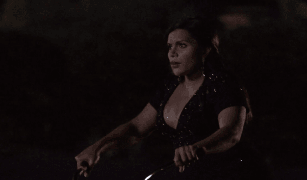 Mindy rides a bike to go see Danny. mindy 4