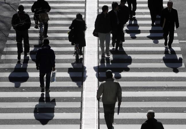 People walk on a crosswalk Employees