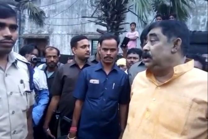 TMC leader Anubrata Mondol speaks to a cop as he alleges that few TMC supporters were manhandled by some assailants in the village at Bolpur vicinity, threatens to burn their homes if not arrested Mondol 111111