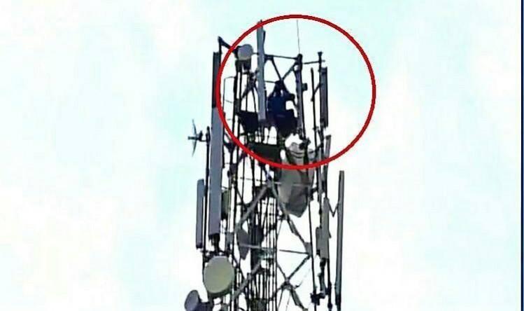 Telengana: Man alleges false domestic violence complaints by wife, climbs 40 feet telephone tower and threatens to jump Man climbs tower-Telengana