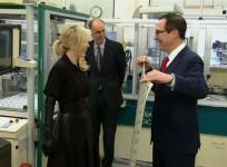US Treasury Secretary Steve Mnuchin and wife Louise Linton pose for photos with dollar bills